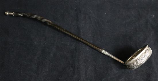 A George IV Scottish embossed silver toddy ladle with baleen handle by Peter Aitken I, Glasgow, 1826, 15.25in.